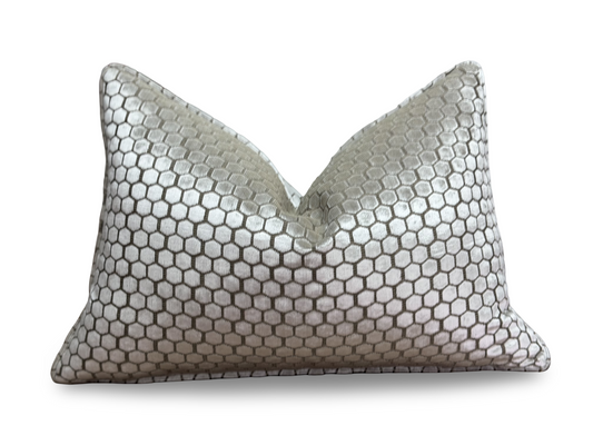 A rectangular lumbar pillow with a metallic silver honeycomb pattern, photographed against a clean white background.