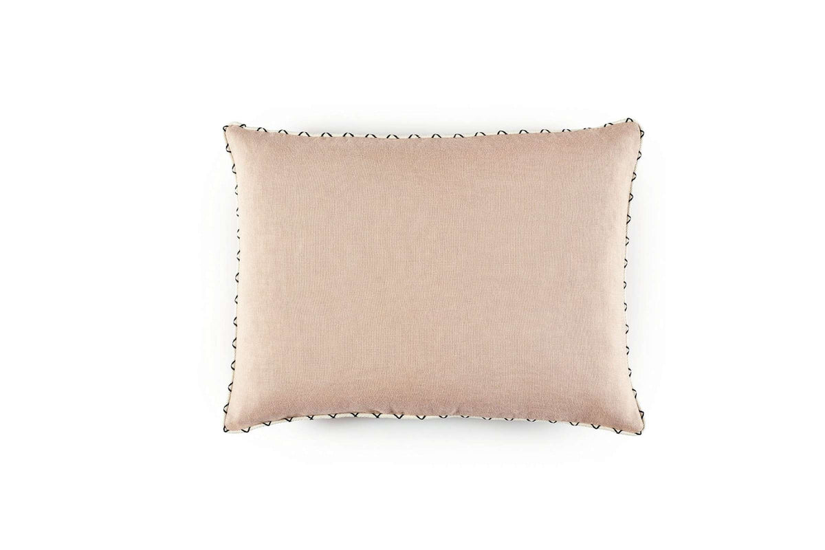 Beige pillow with decorative trim on a white background
